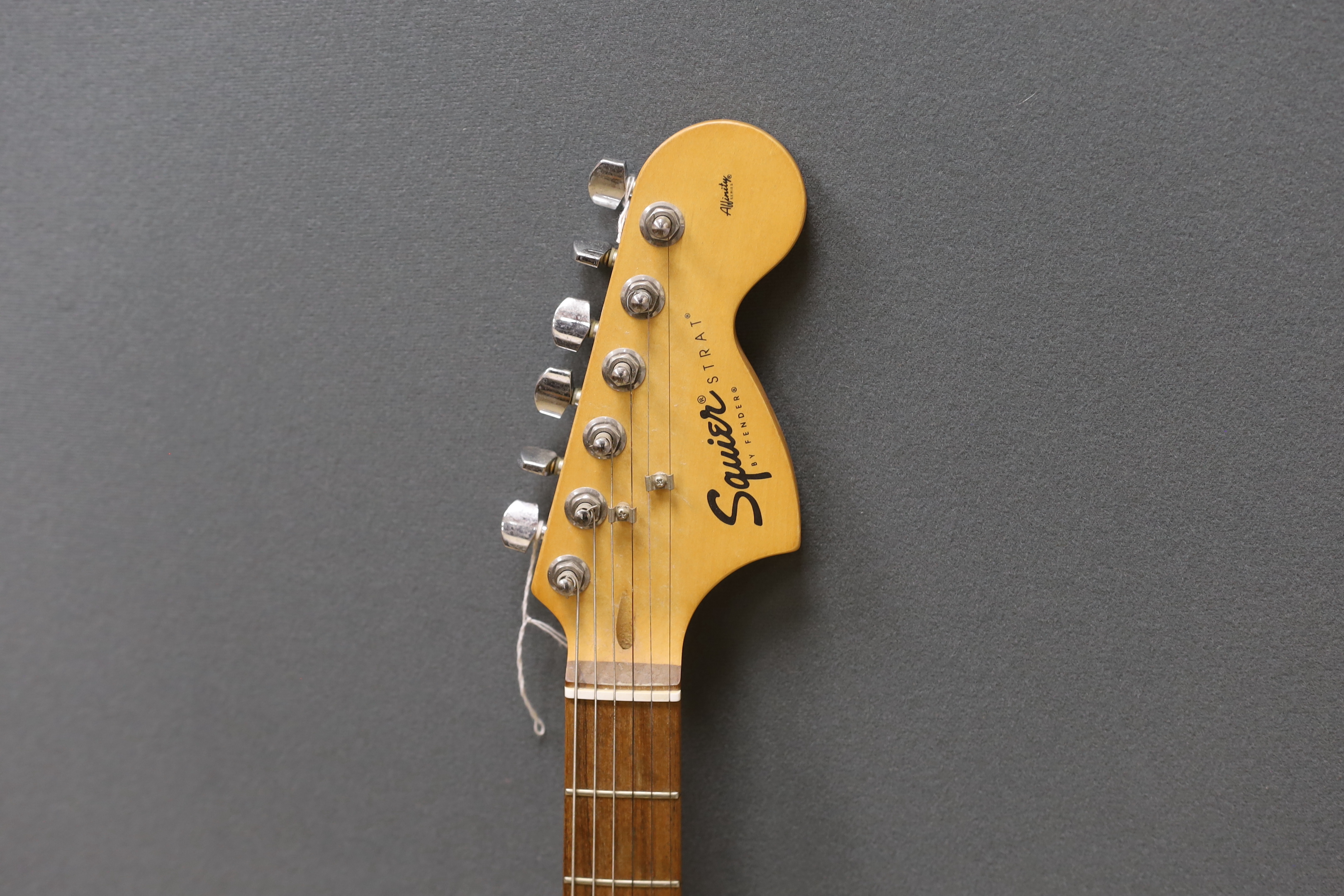 A Fender Squier 20th anniversary electric guitar with soft case